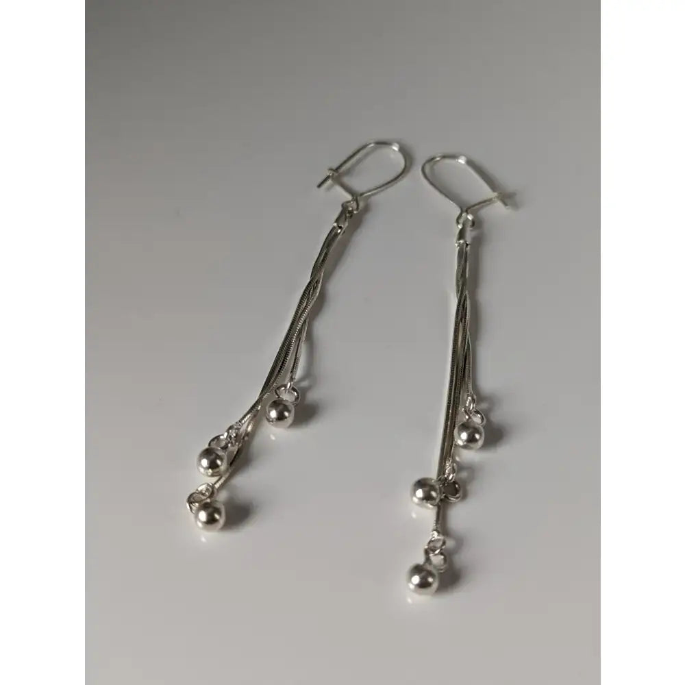 Silver steed rope ball dropped earrings with cascading thin chains and small polished silver beads in dropped style