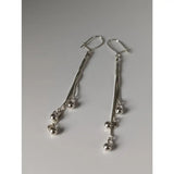 Silver steed rope ball dropped earrings with cascading thin chains and small polished silver beads in dropped style