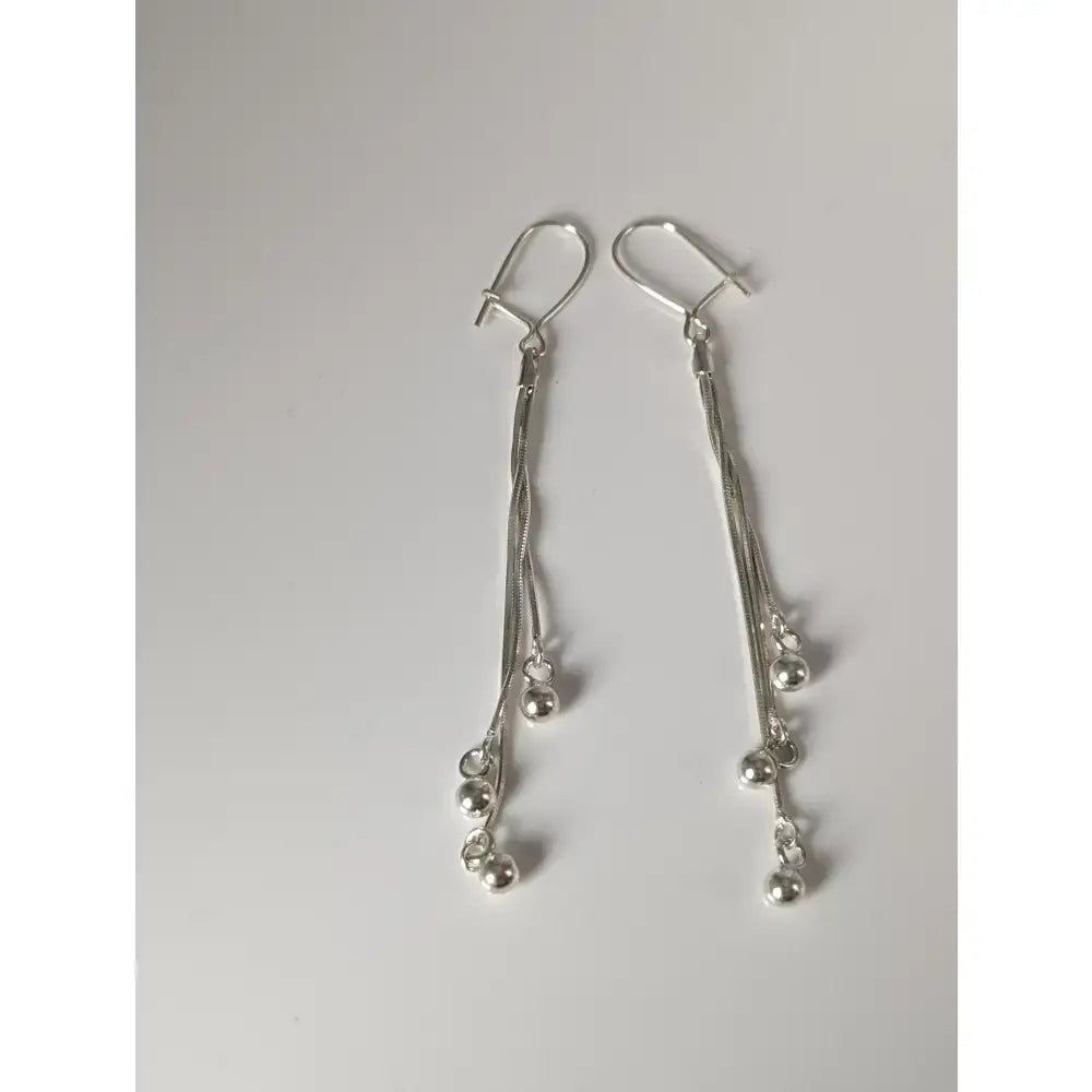 Silver steed rope ball dropped earrings with delicate silver chains and small beads for stylish dropped earrings look
