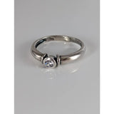 A sleek silver steed silver round zirconia ring with a single clear round-cut gemstone in a modern design