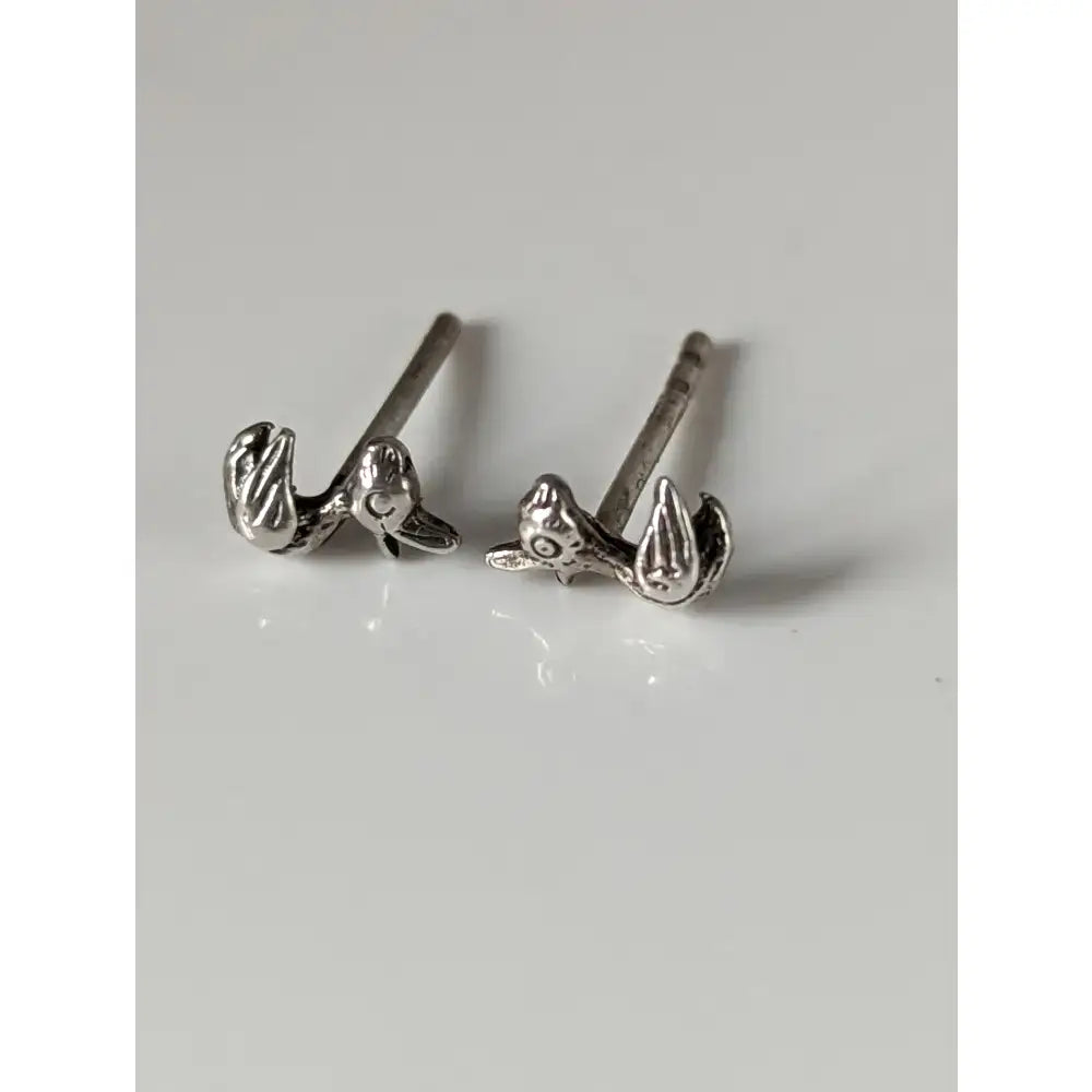 Silver steed rubber duck stud earrings featuring detailed feather and beak designs in sterling silver duck stud earrings