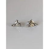 Silver steed earrings shaped like horse riding boots with textured leather details and a small silver buckle accent