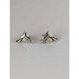 Silver steed silver saddle stud earrings with textured metallic finish and detailed craftsmanship in silver