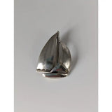 Silver steed sailing boat silver pendant is a silver sailboat-shaped brooch with polished finish and detailed hull and sails