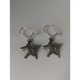 Silver steed sea star dropped earrings featuring silver star dropped earrings with textured detailing and hook clasps