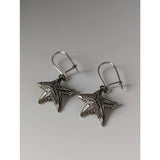 Silver steed sea star dropped earrings featuring silver starfish design with intricate leaf detailing and hook closures
