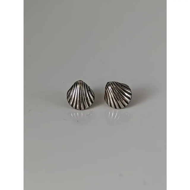 Silver steed shell stud earrings with a textured ridged design featuring unique designs in silver shell shape