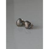 Silver steed shell stud earrings with a textured ribbed design and unique designs in a shell shape