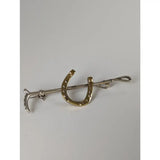 Gold-toned silver steed shoe stock tie pin with silver metal clasp and decorative cane gold brooch details