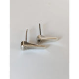 Silver steed silver-toned stud earrings shaped like short hoof nail horseshoes with a polished metallic finish