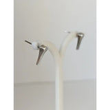 Silver steed short hoof nail stud earrings with silver-toned angular design and small white spherical accents