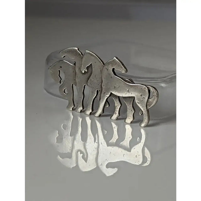 Silver steed signature silver-toned metal stock tie pin with three stylized horse silhouettes herd silver brooch design