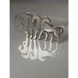 Silver steed signature silver-toned herd silver brooch with three stylized horses for use as a stock tie pin