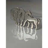 Silver steed signature silver-toned metal stock tie pin with three stylized horse figures in interlocking herd silver brooch design