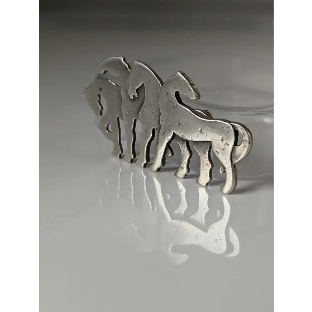 Silver steed signature silver stock tie pin featuring a minimalist layered herd silver brooch design with horses