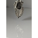 Silver steed signature horse head pendant with textured hammered silver dragon design and intricate scales detail