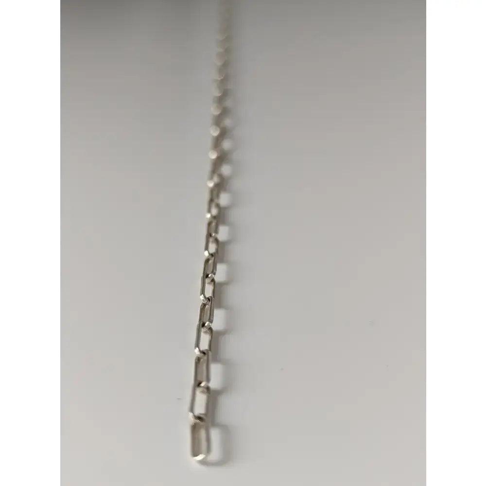 Silver steed slim link silver bracelet featuring a silver-toned paperclip-style chain link design