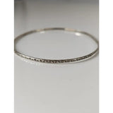 Silver steed slim silver bangle with intricate floral engraving on a vine silver bangle design in silver tone