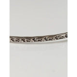 Silver Steed Slim silver bangle with intricate floral vine engraving in shiny silver perfect for everyday wear