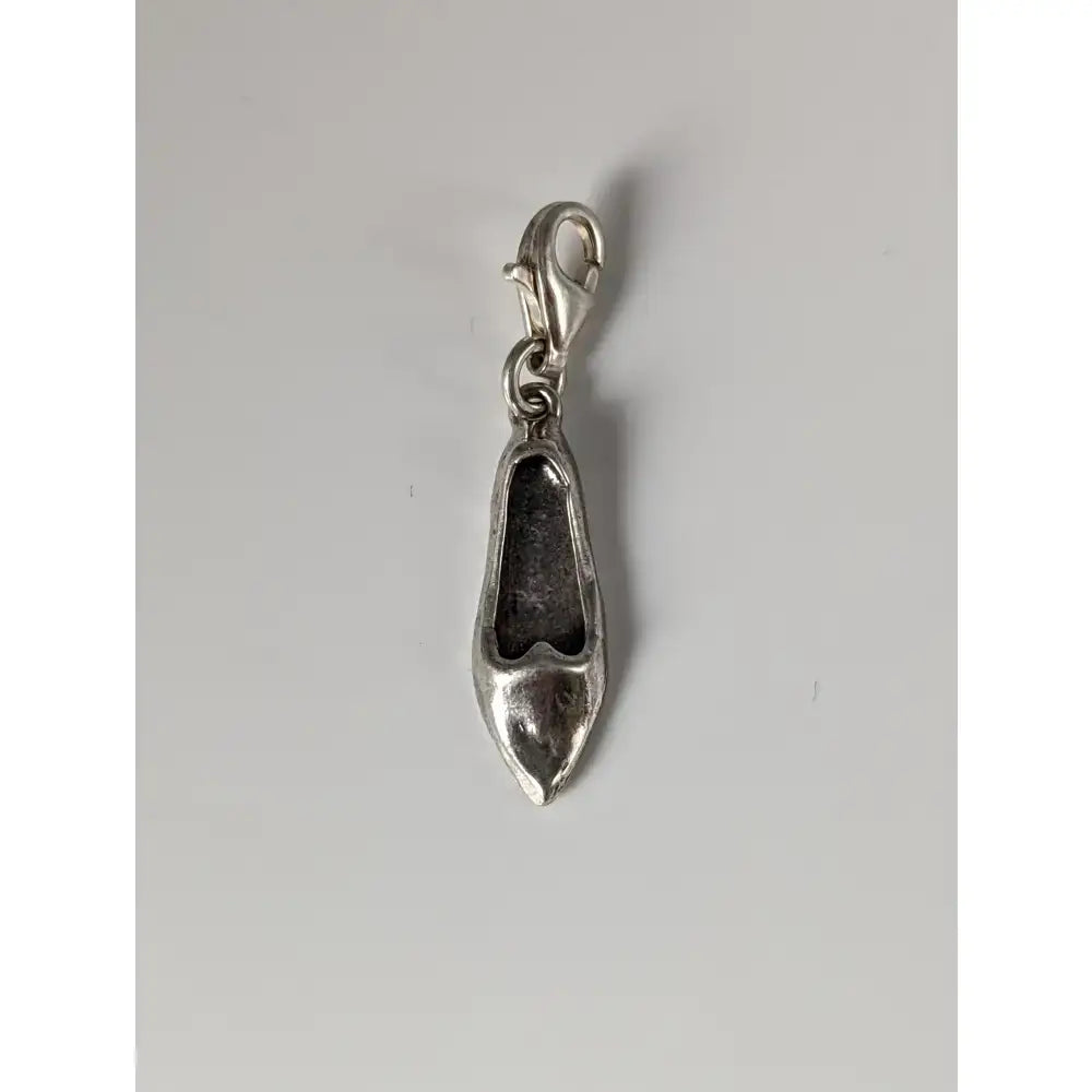 Silver steed slipper silver charm is a silver-colored metal slipper silver charm with a lobster clasp attached
