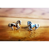Silver horse stud earrings in small silver sterling design with detailed manes in a dynamic galloping pose