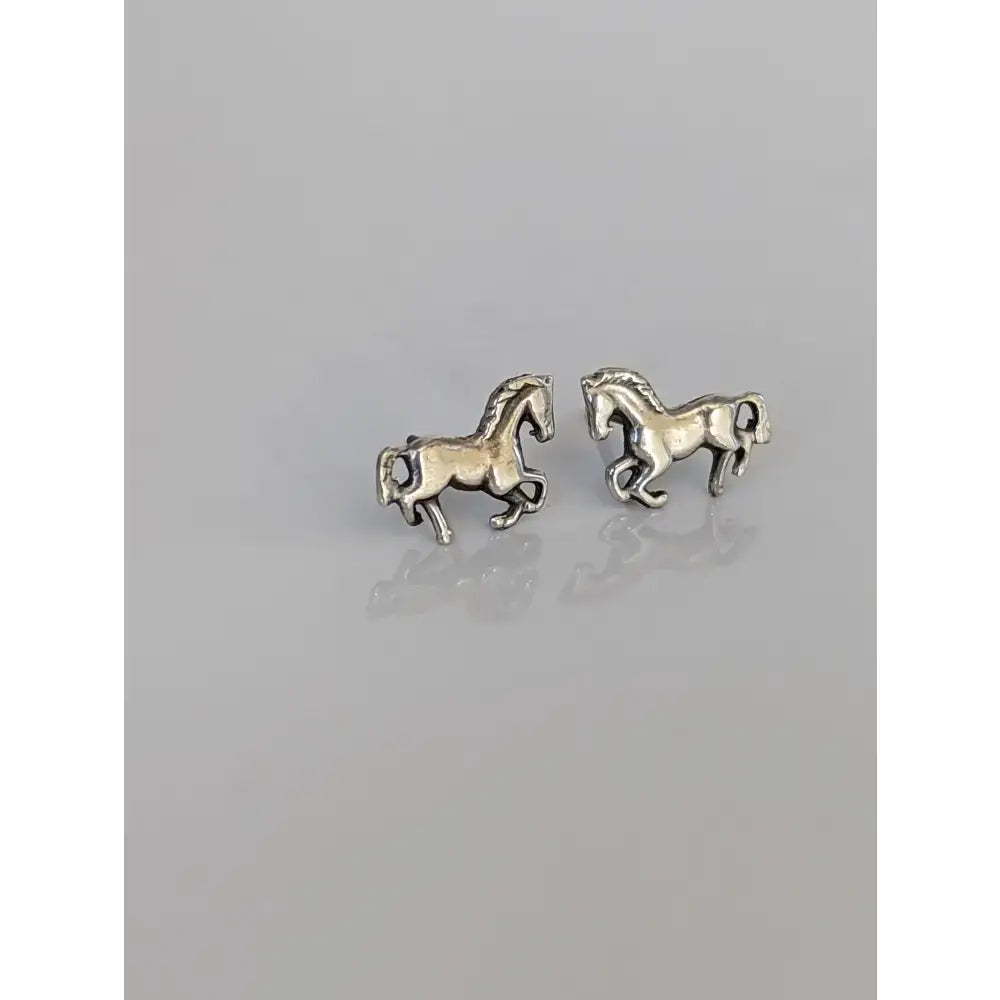 Small silver horse stud earrings with polished silver finish and detailed horse design perfect for everyday wear