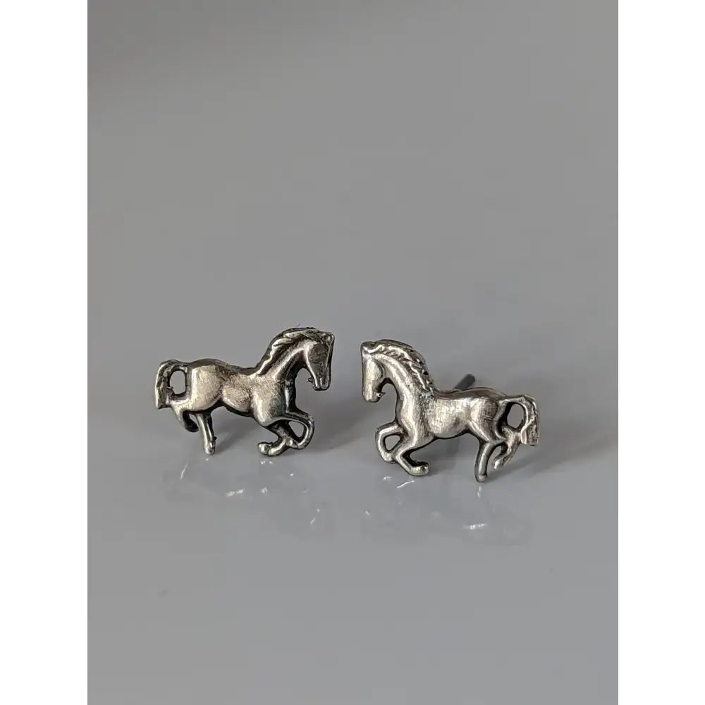 Small silver horse stud earrings in silver with detailed textured finish perfect as horse stud earrings