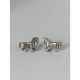 Small silver horse stud earrings in silver with detailed sculpted manes and tails perfect as horse stud earrings