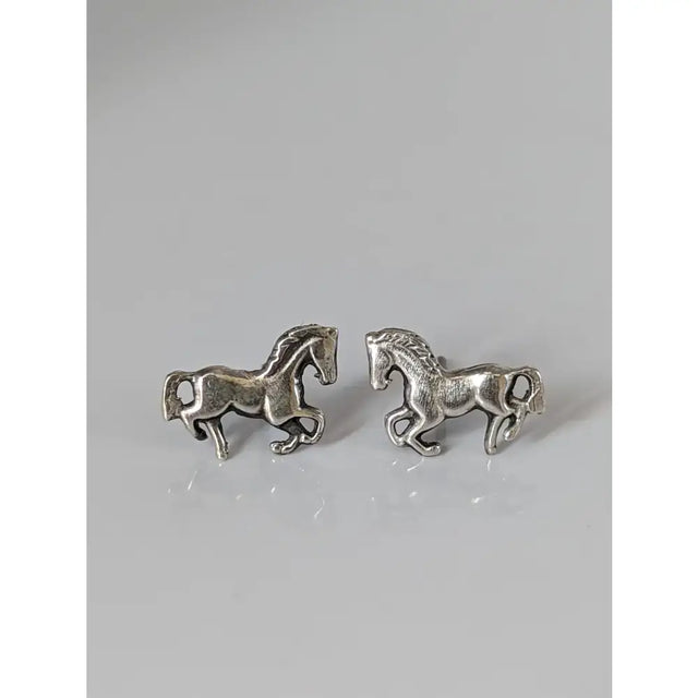 Small silver horse stud earrings in silver with detailed sculpted manes and tails perfect as horse stud earrings