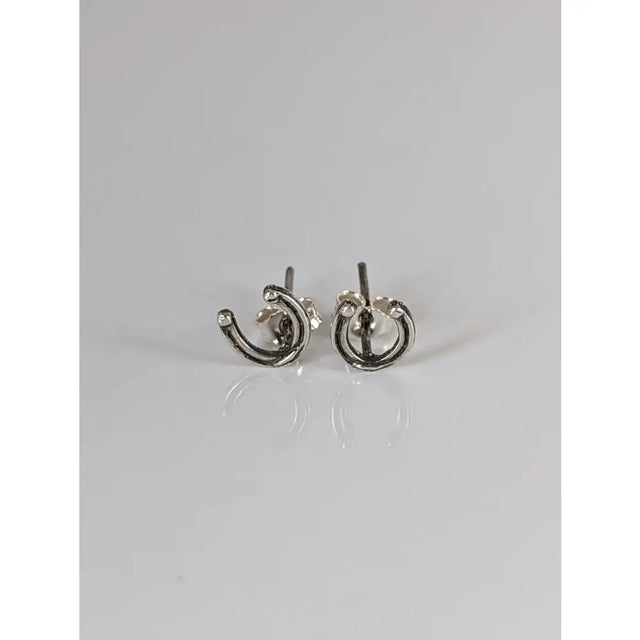 Silver steed small sterling silver horseshoe stud earrings with a minimalist textured design