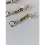 Silver steed snaffle bit stud earrings with silver and gold-toned polished sterling silver bit design