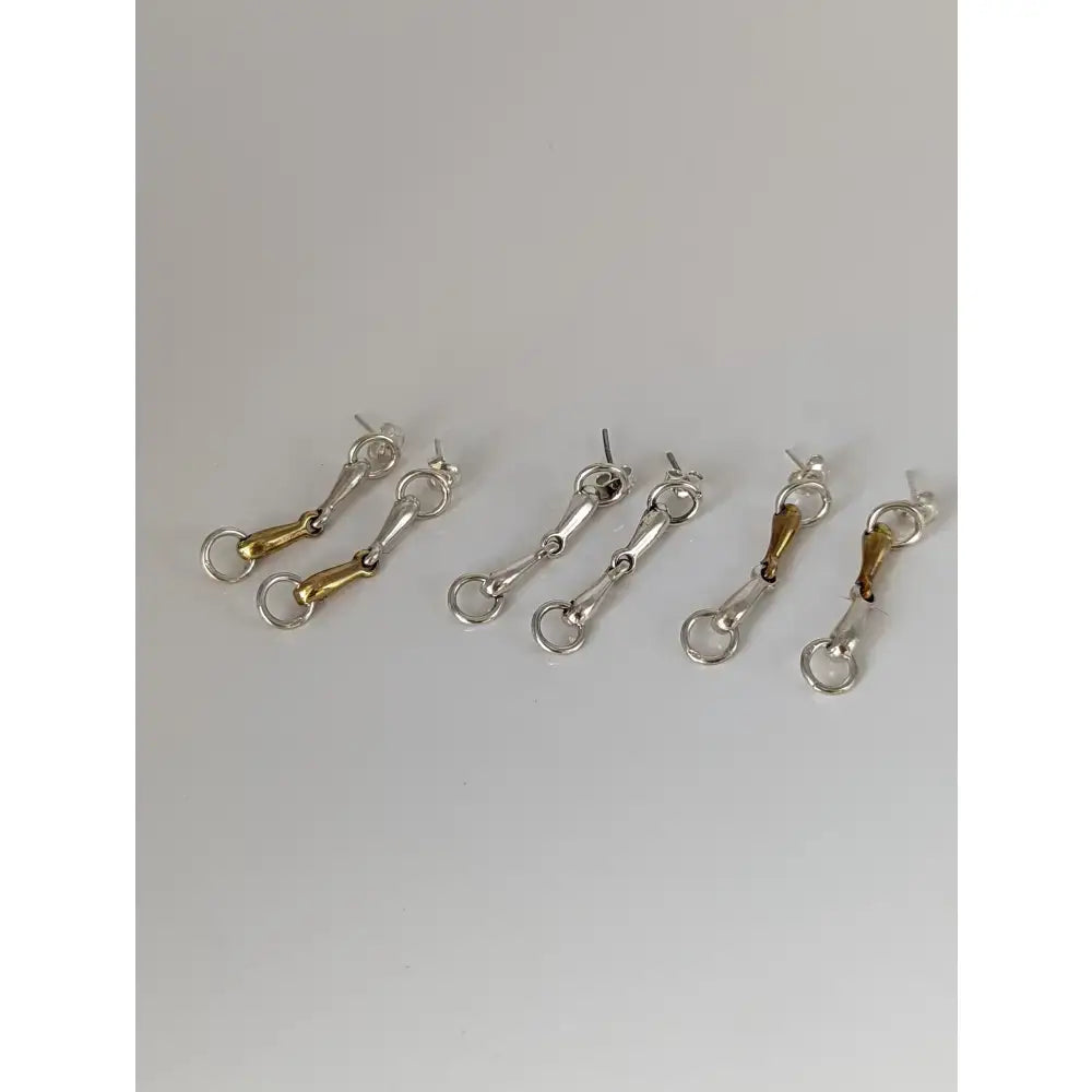 Silver steed snaffle gold and silver-toned sterling silver bit earrings with a sleek minimalist design