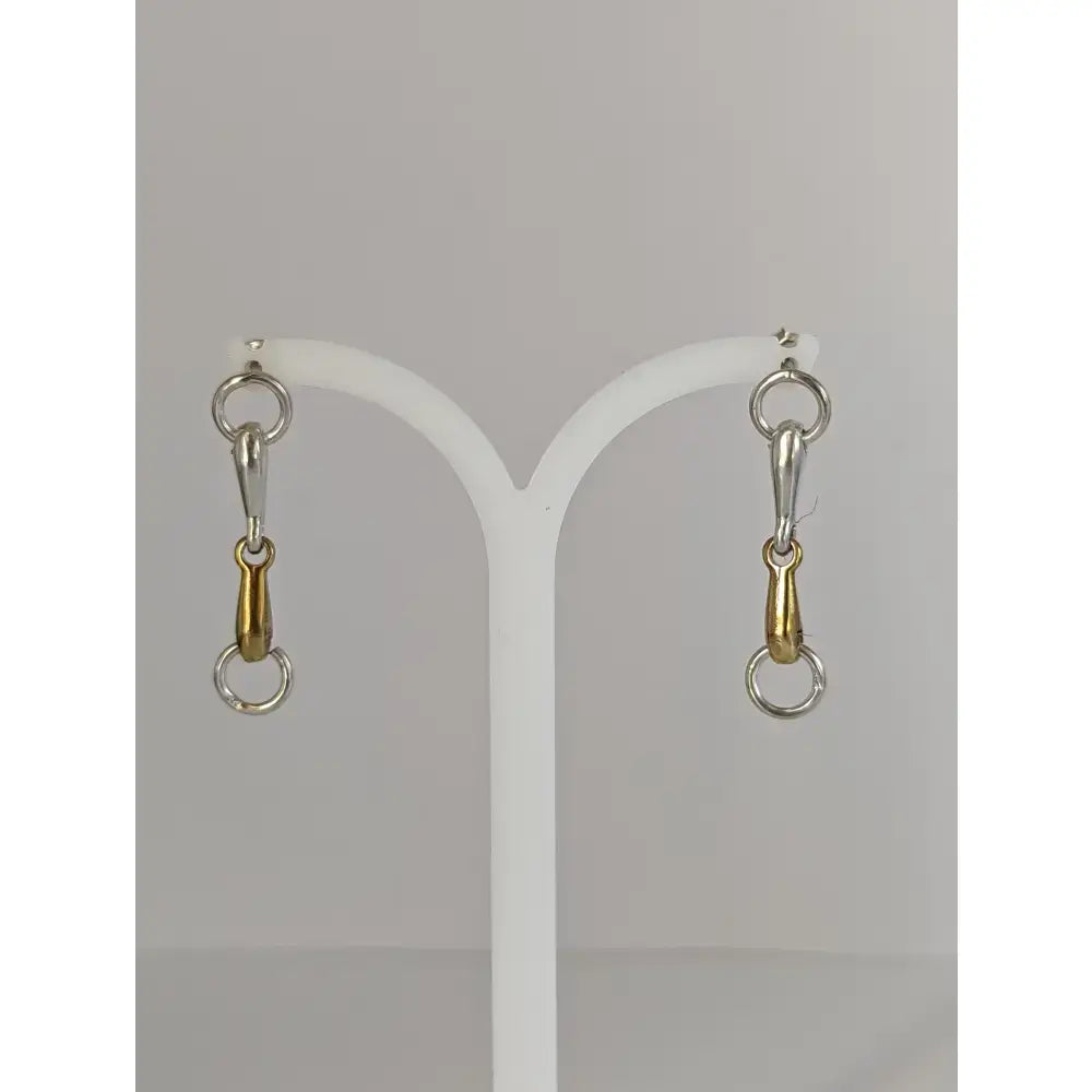 Silver steed snaffle bit stud earrings in silver and gold tones with a sleek polished finish in sterling silver bit earrings style