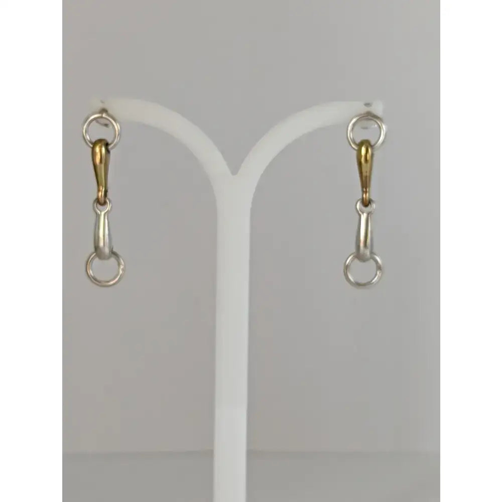 A pair of silver steed snaffle two-tone snaffle bit stud earrings in polished sterling silver and gold finish