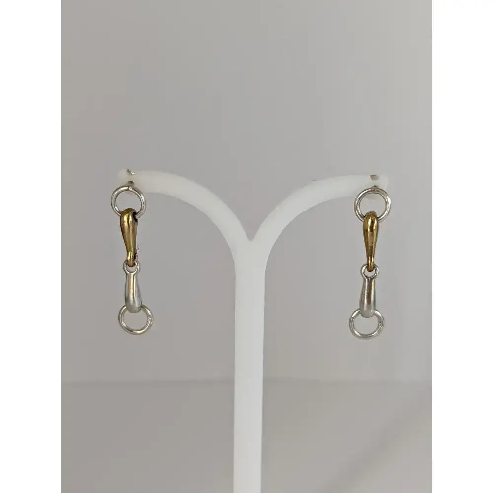 Silver steed snaffle two-tone snaffle bit stud earrings in polished gold and sterling silver with a minimalist design