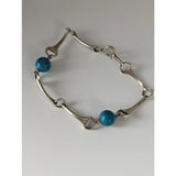 Silver steed snaffle solid silver bracelet with turquoise beads in vibrant blue for stylish everyday wear