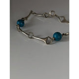 Silver steed snaffle solid silver bracelet with turquoise beads showcasing a stylish horsebit design