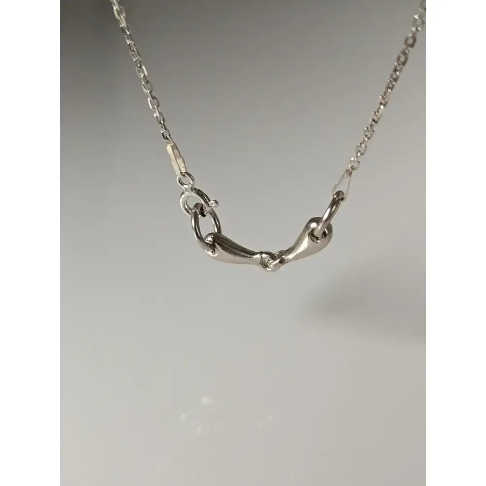 Silver steed snaffle necklace with a sleek silver horsebit pendant and delicate polished chain