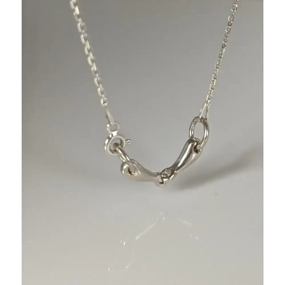 Silver steed snaffle necklace with a delicate silver chain and elegant horsebit design