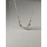 Silver steed snaffle necklace with sleek silver horsebit design and polished minimalist metal finish