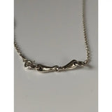 Silver steed snaffle necklace with silver horsebit style and textured elongated pendant on a fine chain