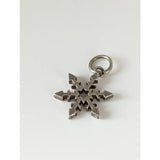 Silver steed snowflake sterling silver pendant with intricate symmetrical design and small ring for attachment
