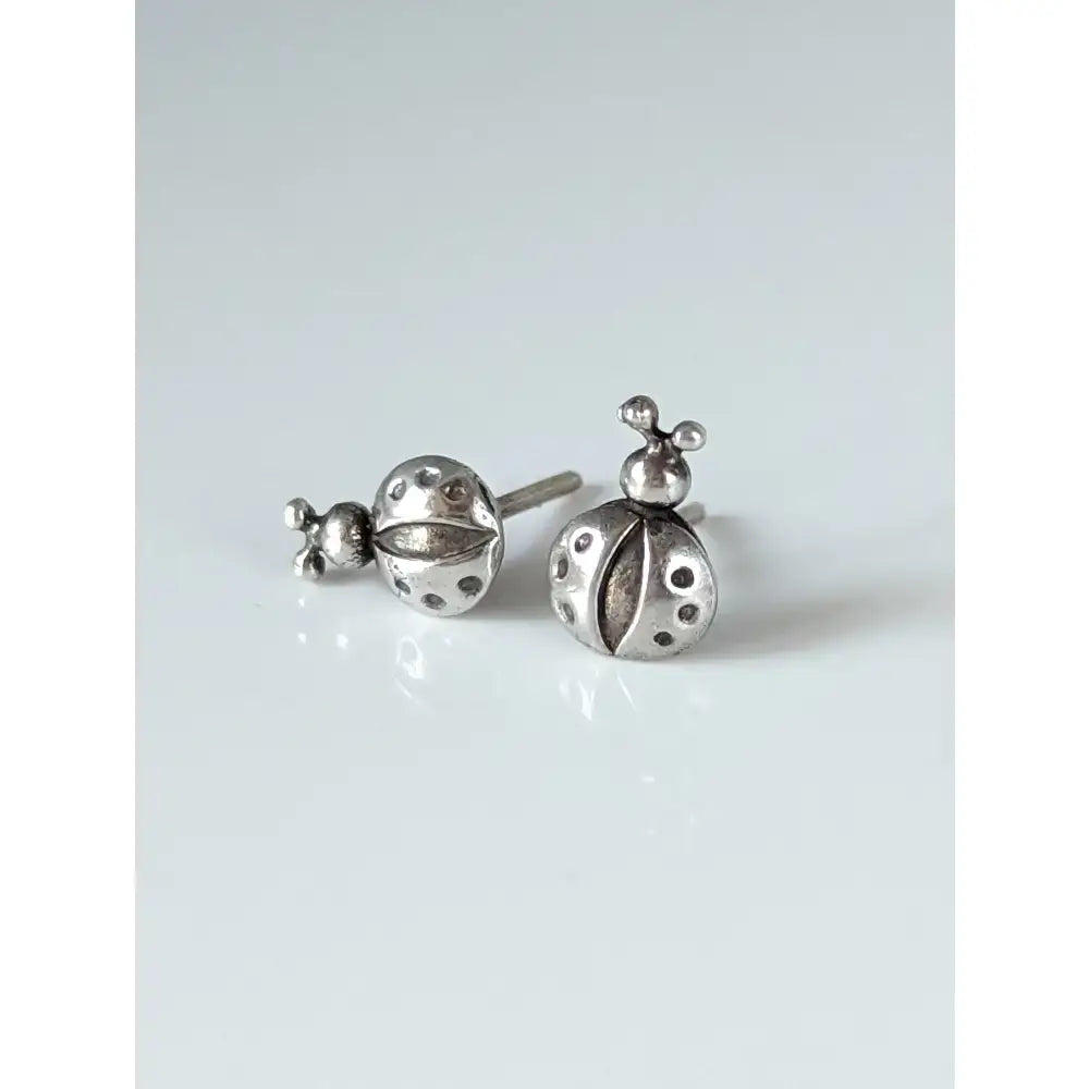 Silver steed spotted ladybird stud earrings featuring silver ladybugs with detailed black dots and tiny antennae