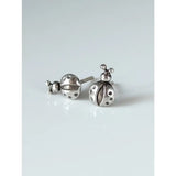 Silver steed spotted ladybird stud earrings featuring silver ladybugs with detailed black dots and tiny antennae