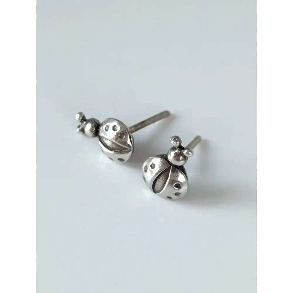 Silver steed spotted ladybird stud earrings featuring detailed dot patterns and tiny antennae in silver ladybird stud earrings