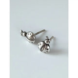 Silver steed spotted ladybird stud earrings featuring detailed dot patterns and tiny antennae in silver ladybird stud earrings