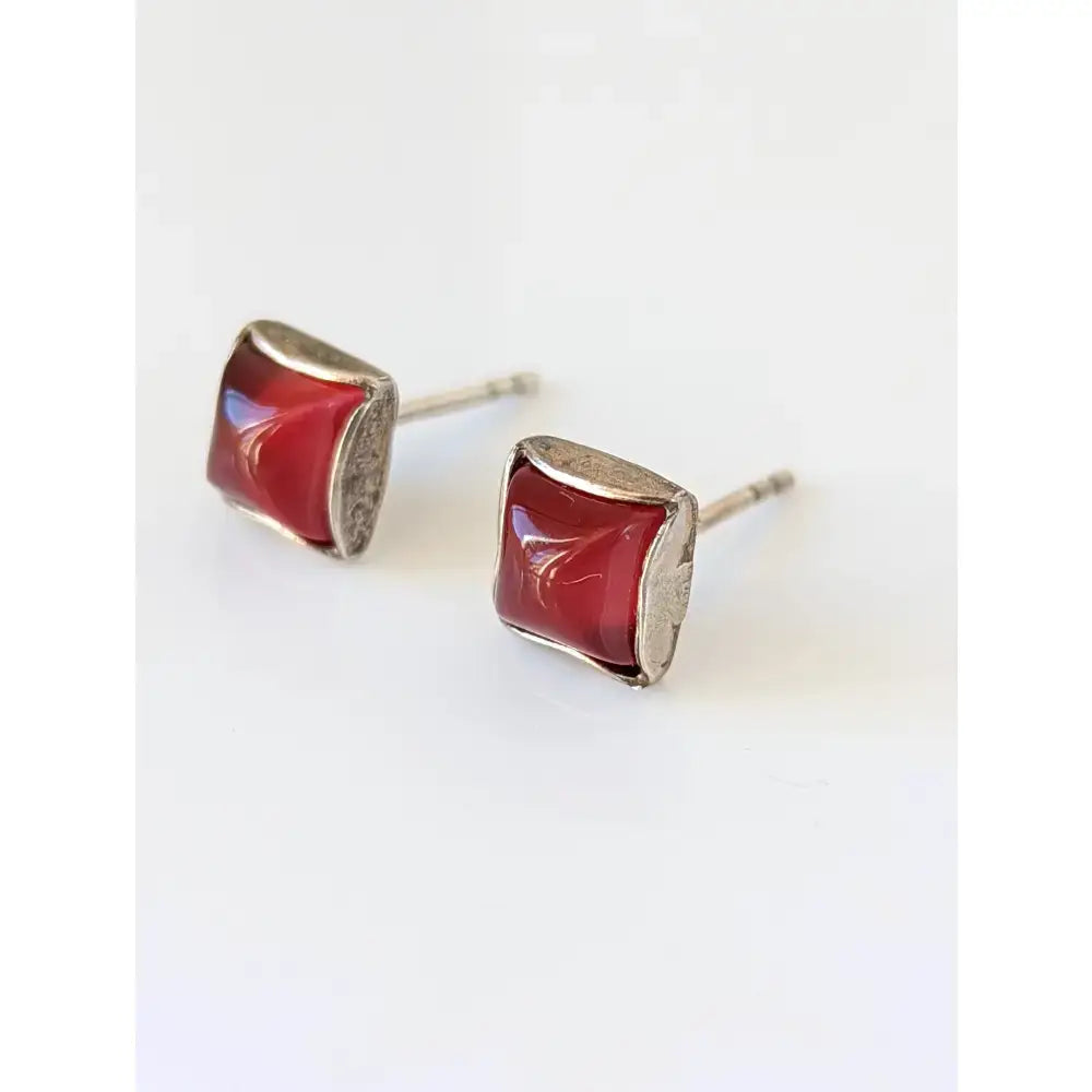 Silver steed square coloured stud earrings featuring red glass stones in a sterling silver setting