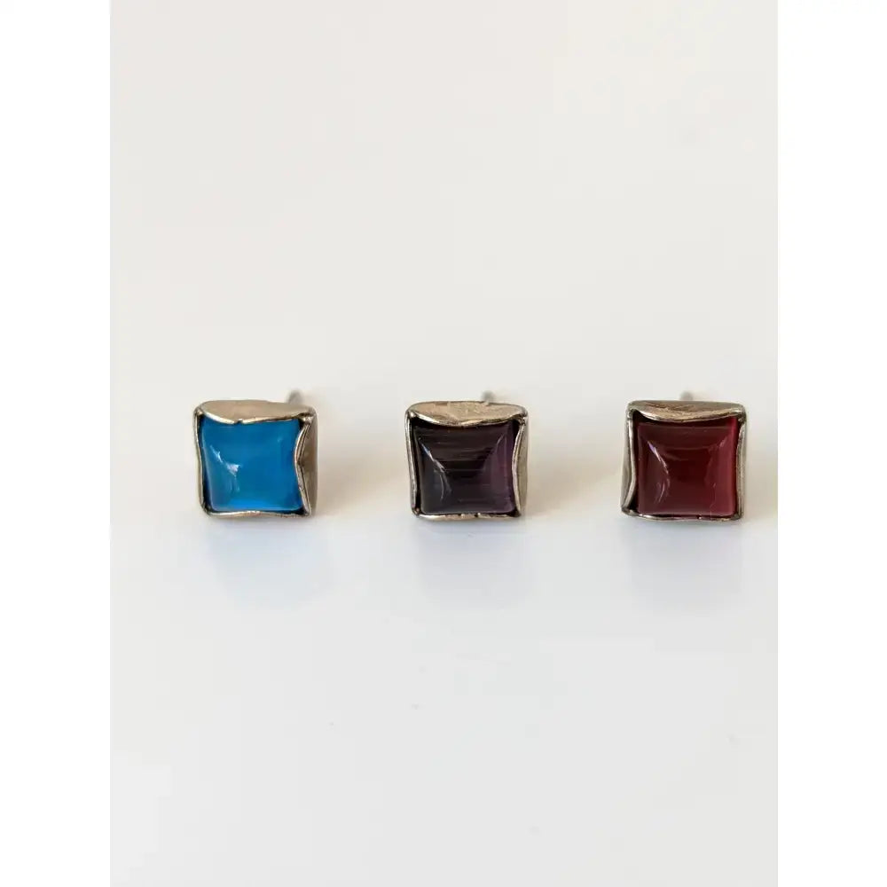 Silver steed square coloured stud earrings with vibrant blue dark purple and deep red stones in sterling silver setting