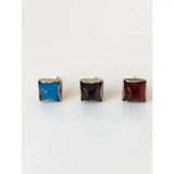 Silver steed square coloured stud earrings with vibrant blue dark purple and deep red stones in sterling silver setting