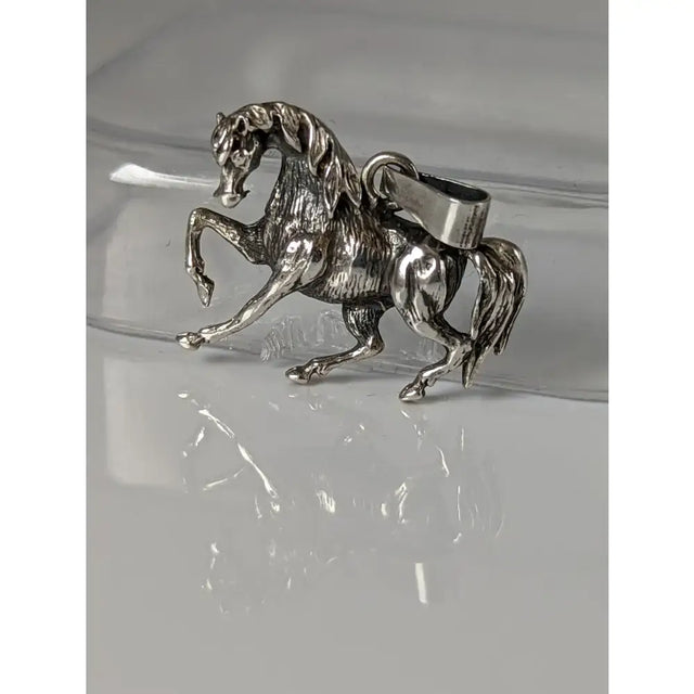 Silver steed stallion silver pendant with detailed sculpted mane and tail and sturdy metal clasp for easy attachment